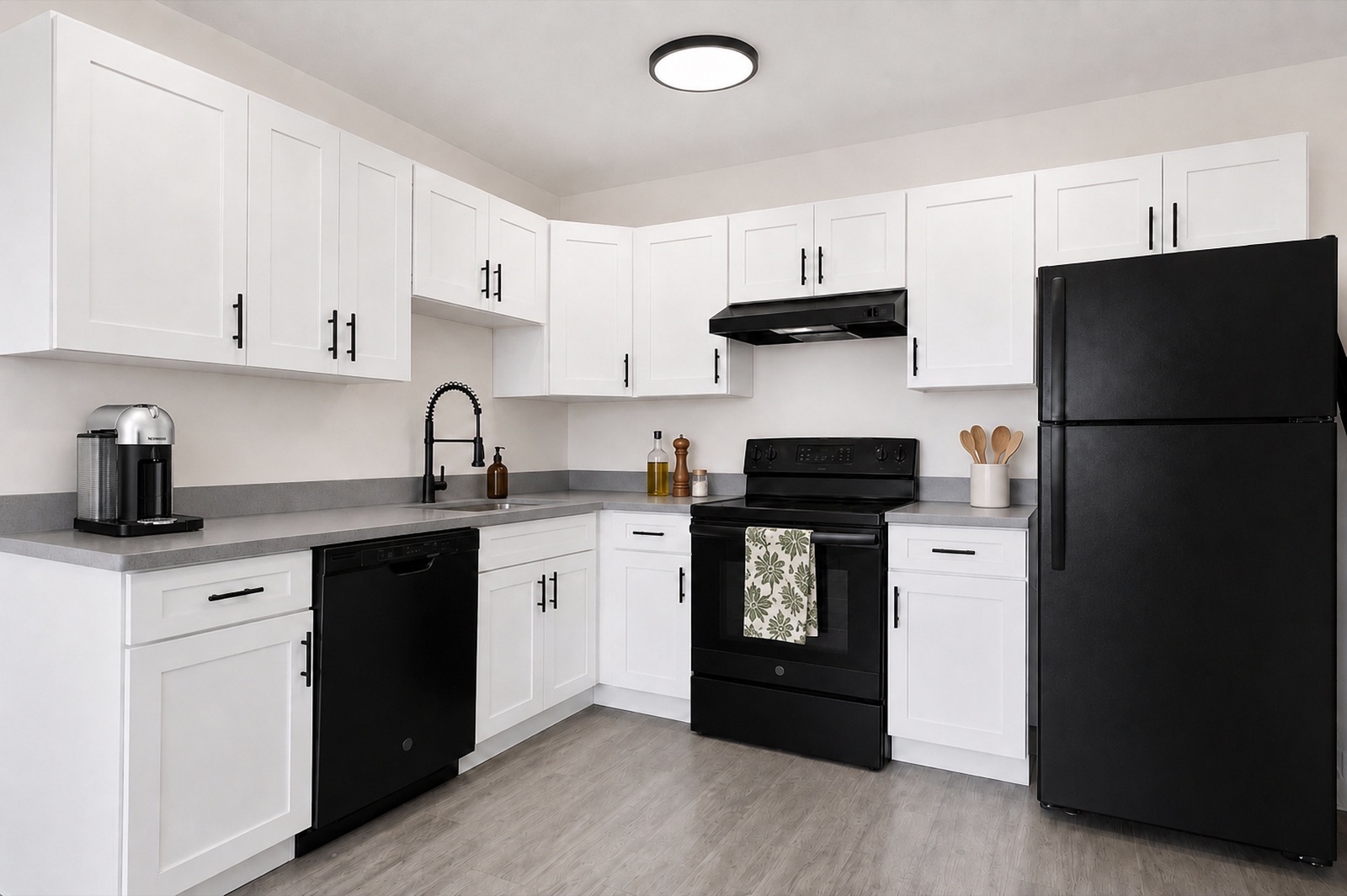 Renovated kitchen with white shaker cabinets at 197 Calumet St, Unit 4